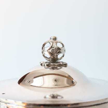 close up of silver kettle lid